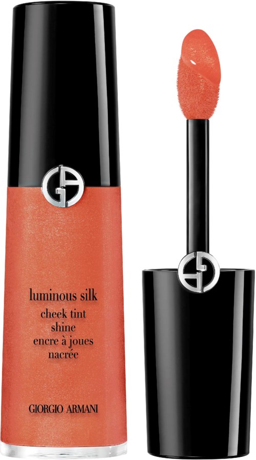 A Giorgio Armani lip gloss with a black cap and applicator, named Luminous Silk Cheek Tint Shine, in peach color.