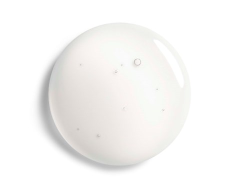 A white, glossy, round object with small bubbles inside on a white background.