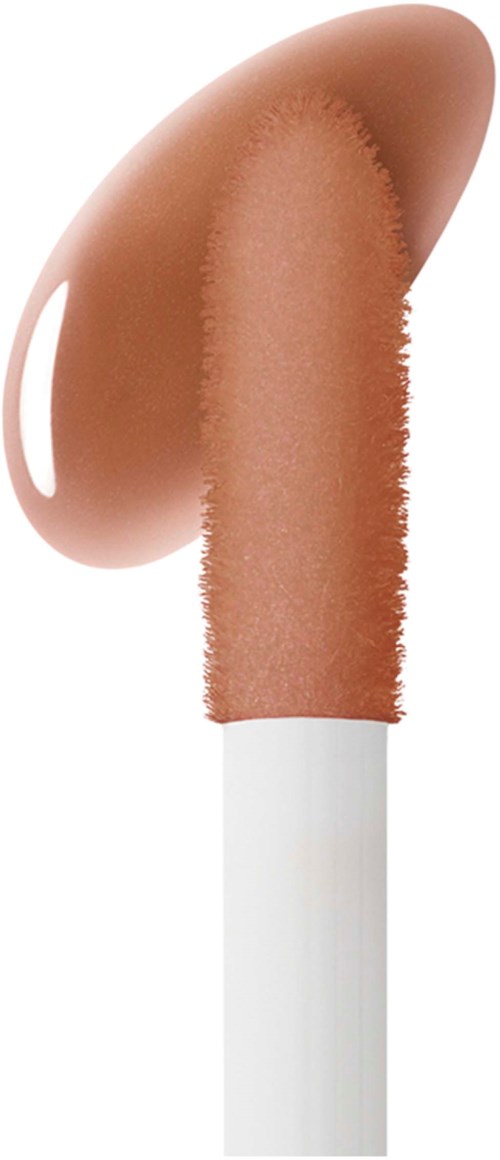 Ein Kosmetikpinsel mit beiger, cremiger Substanz, wahrscheinlich Foundation oder Concealer.