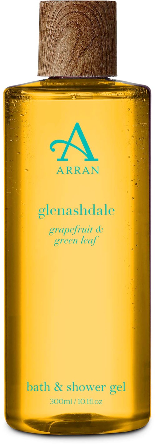 Eine gelbe Flasche mit Holzdeckel, beschriftet 'Glennadshade Grapefruit & grünes Blatt Bad- & Duschgel,' 300ml.