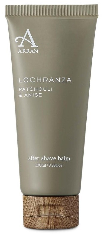 Eine graue Tube mit Holzdeckel enthält After-Shave-Balsam. Es ist mit Markennamen und Duftdetails beschriftet.