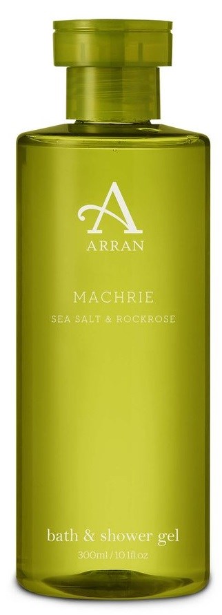 Grüne Flasche mit Bade- und Duschgel, beschriftet mit 'Arran Machrie Sea Salt & Rock Rose' und einem großen weißen A.