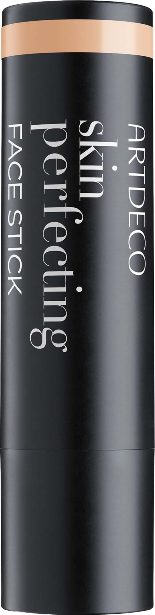 En svart cylindrisk ansiktsstift med ett guldfärgat lock. Produktetiketten säger Skin Perfecting Face Stick av Artdeco.