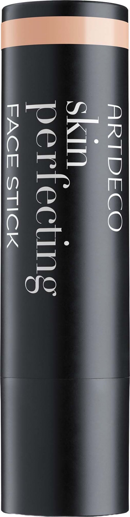 En svart cylinderformad ansiktsstift med en rosa-beige rand längst upp och vitt text som säger ARTDECO skin perfection face stick.