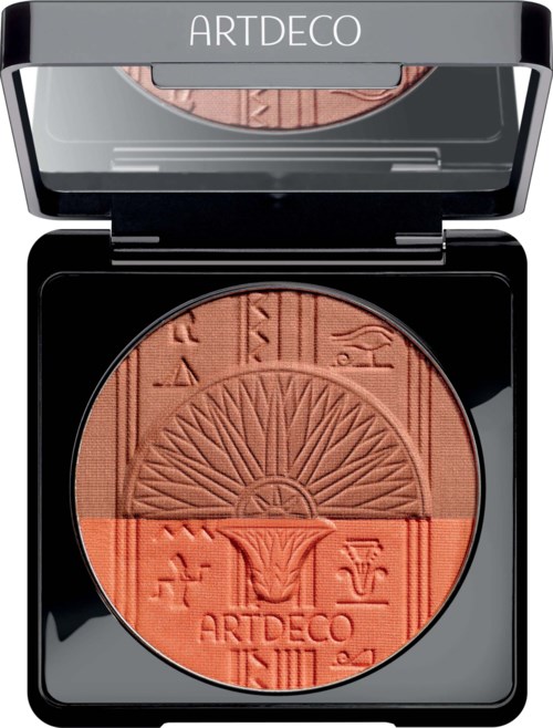 En kompakt makeuprouge med präglade mönster och symboler, delad i varma orange och bruna nyanser.