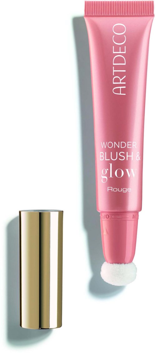 Eine pinke Tube mit weißem und goldenem Deckel für Make-up, bezeichnet Artdeco Wonder Blush & Glow, ohne Deckel.