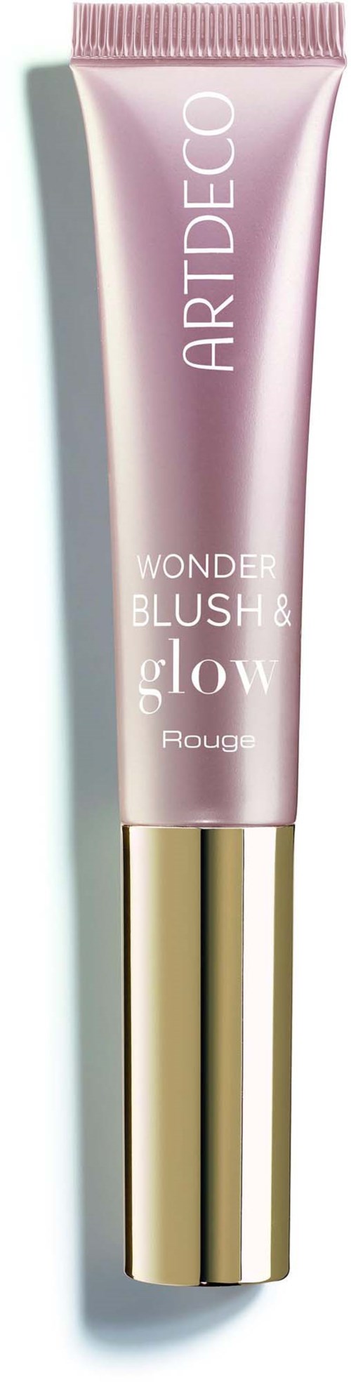 Eine rosa Schminktube mit Goldkappe, markiert Wonder Blush Glow von ART DECO.