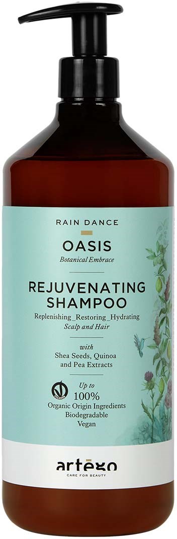 A brown shampoo bottle with a black pump and a blue label that has green plants and text describing hair benefits.