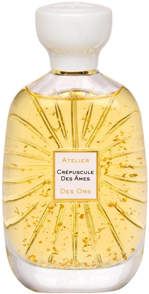 A clear glass perfume bottle with a white cap and golden liquid inside, adorned with a label. Unique design with sunray pattern.