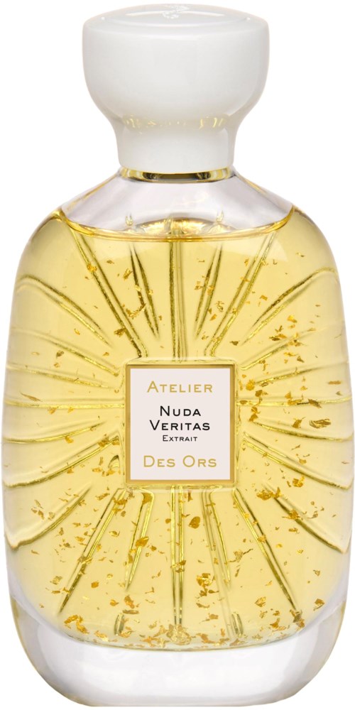 A clear bottle with a white cap, filled with yellowish liquid and small gold particles inside.