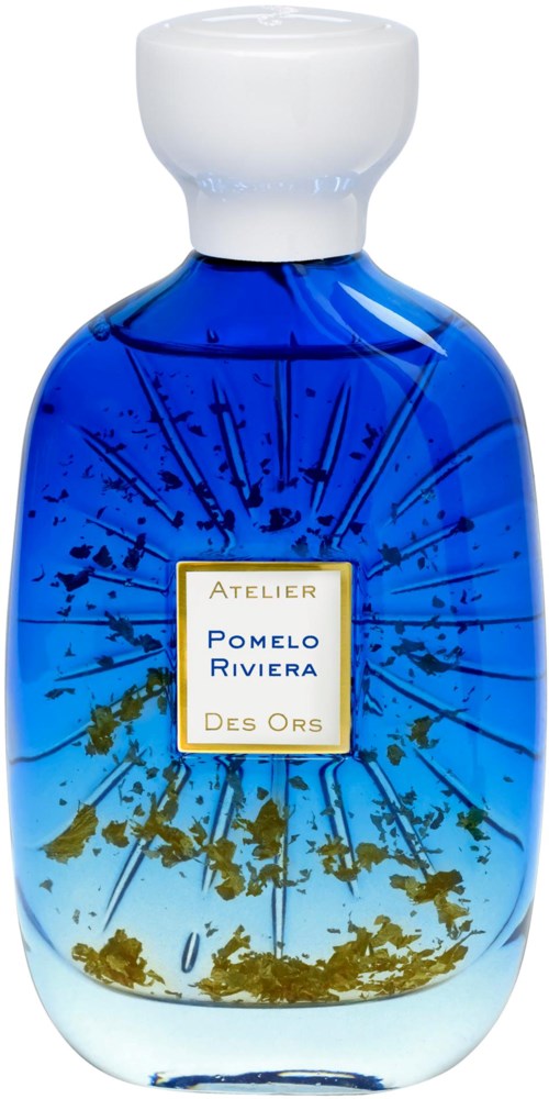 Blue glass bottle with a white cap, labeled Atelier Pomelo Riviera Des Ors, contains a decorative liquid with gold and green elements.