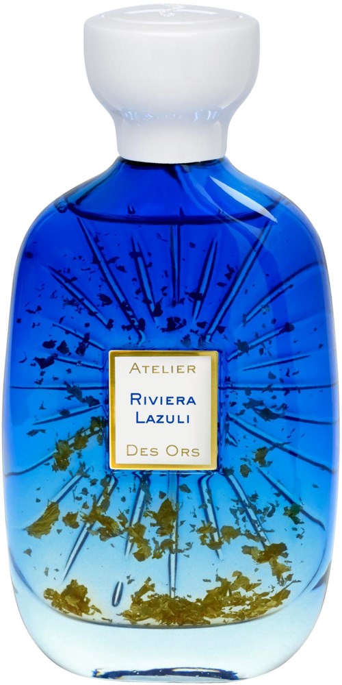 A blue glass perfume bottle with gold and white label and a white cap.