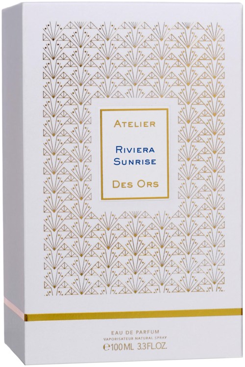 A perfume box with a gold and blue design, featuring floral patterns and text about the fragrance.