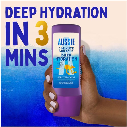 A hand holds a purple bottle with blue and yellow label, promoting deep hydration in three minutes.