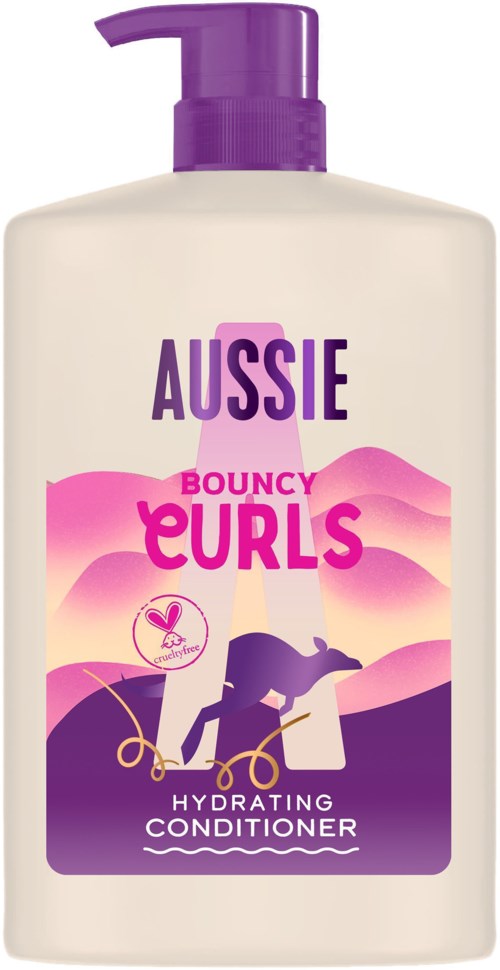 A bottle with purple pump labeled 'Aussie Bouncy Curls Hydrating Conditioner' showing a woman with curly hair on the label.