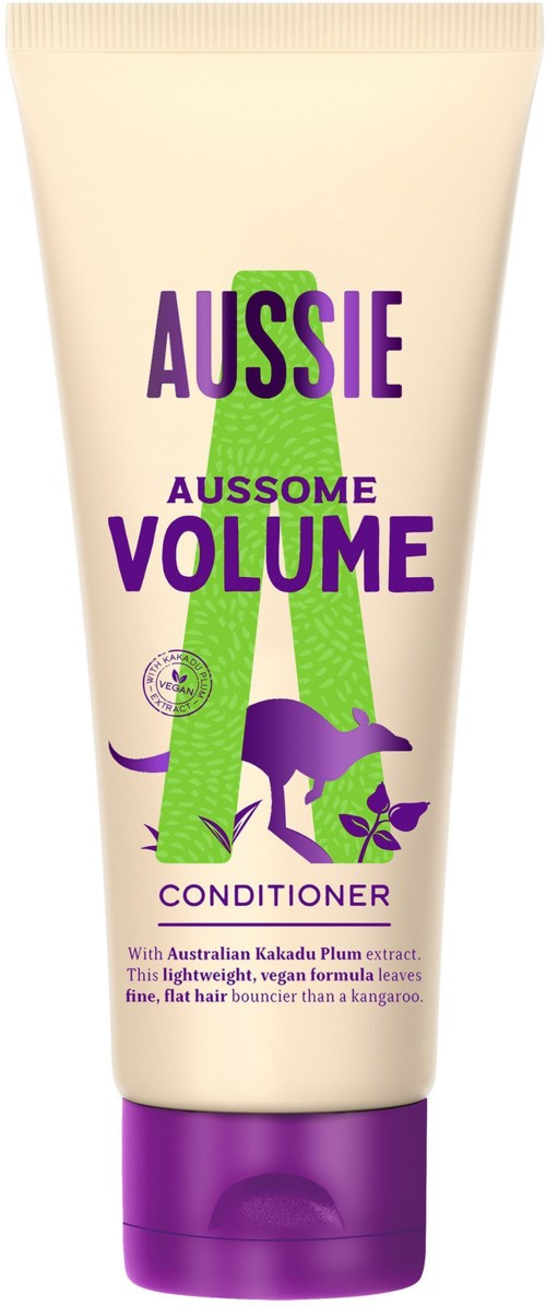 A conditioner tube with purple and green text and a kangaroo illustration, promoting Australian Kakadu Plum extract for hair.