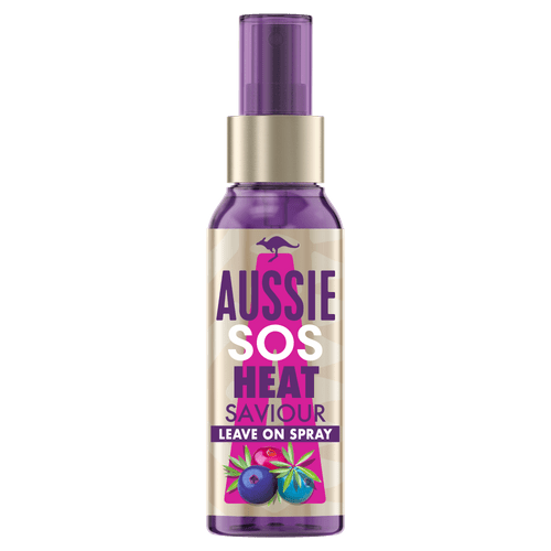 Purple spray bottle labeled 'Aussie SOS Heat Saviour Leave On Spray' with blueberries and leaves illustration.