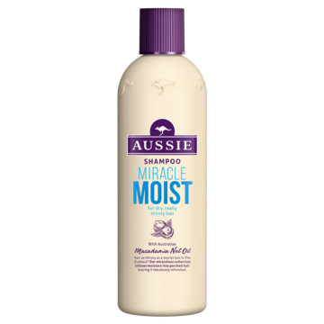 A white bottle with a purple cap, labeled 'Aussie' shampoo, called Miracle Moist, designed for dry hair care.