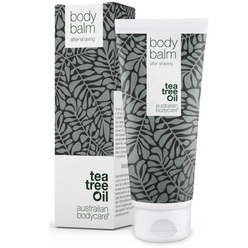 Eine Tube und eine Schachtel mit Körperbalsam mit Teebaumöl von Australian Bodycare, gestaltet mit grauen Blättern.