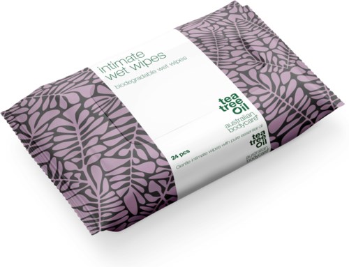 Purple and black packaging of biodegradable wet wipes with leaf pattern and green text.