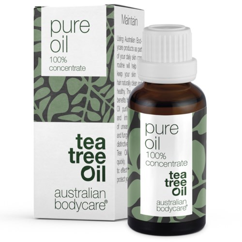 Flasche und Verpackung mit Teebaumöl, natürliches Heilmittel für Haut und Haare, als rein und 100% Konzentrat gekennzeichnet.