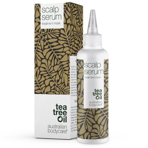 Een hoofdhuidserum in een doorzichtige fles met een puntneus, en een doos met een zwart en goud bladpatroon.