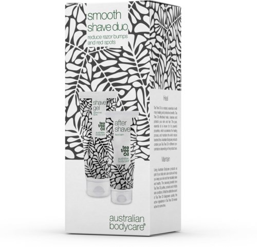 A box with two tubes, mainly black and white plant patterns, labeled for shaving gel and after shave oil.