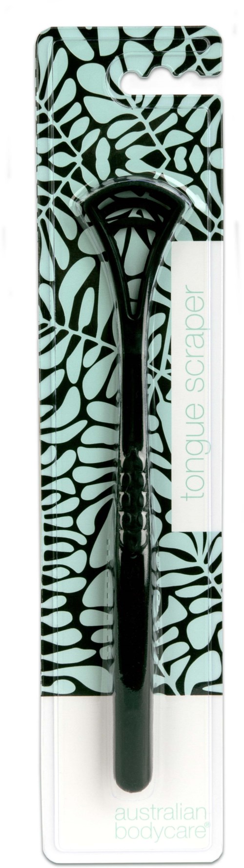 A black tongue scraper with a textured handle in packaging with a leaf pattern design.