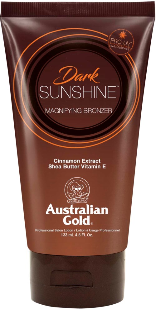 A tanning lotion tube labeled "Dark Sunshine," with cinnamon and shea butter ingredients, Australian Gold brand, 133 ml.
