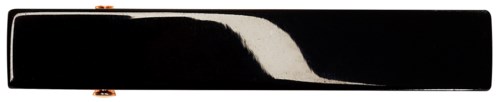 A long black object with a white curve in the middle, possibly a stylized logo or design element.