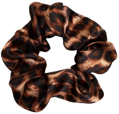 A leopard print hair scrunchie made of shiny fabric in animal pattern. It is circular and elastic.