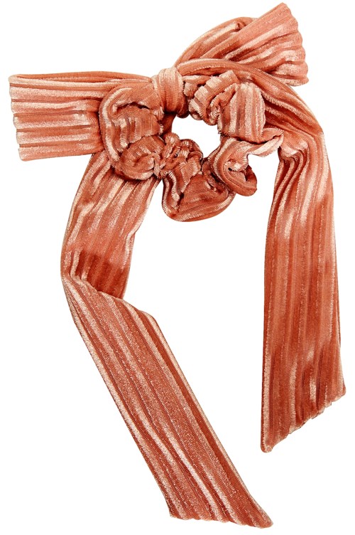 A pink and beige striped fabric tied in a bow with long ends hanging down.