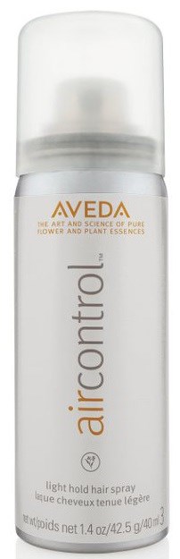Aerosolförpackning för hårspray märkt 'aircontrol' av Aveda, vit flaska med genomskinlig kapsyl.