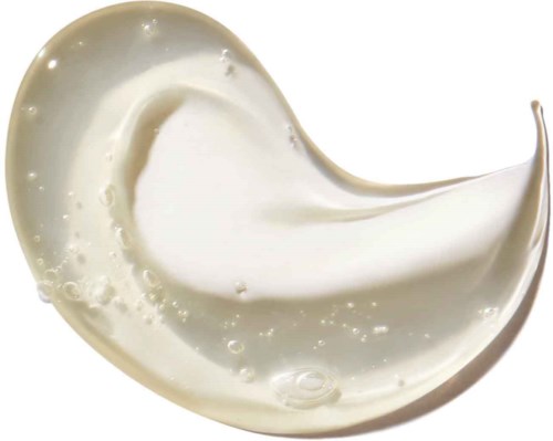 Ein Wirbel aus weißer Creme oder Lotion mit kleinen Blasen und glänzender Oberfläche.