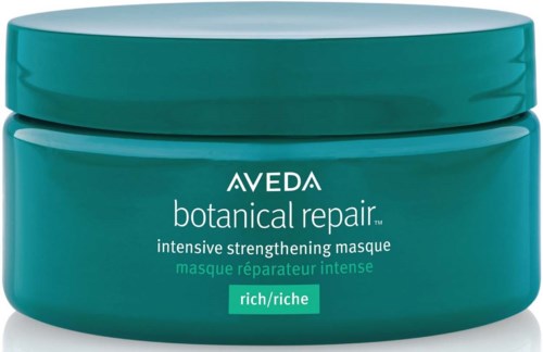 Ein türkisfarbener Behälter mit Aveda botanical repair intensiv stärkende Maske und weißem und grünem Text auf dem Etikett.