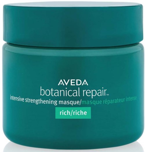 Ein türkisfarbener Behälter von Aveda botanical repair intensiv stärkende Maske, als reich gekennzeichnet. Es hat eine runde Form und einen passenden Deckel.