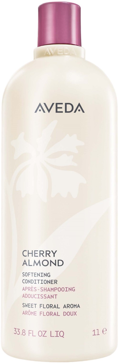 Eine lange weiße Flasche mit Aveda Cherry Almond pflegenden Conditioner mit lila Deckel.