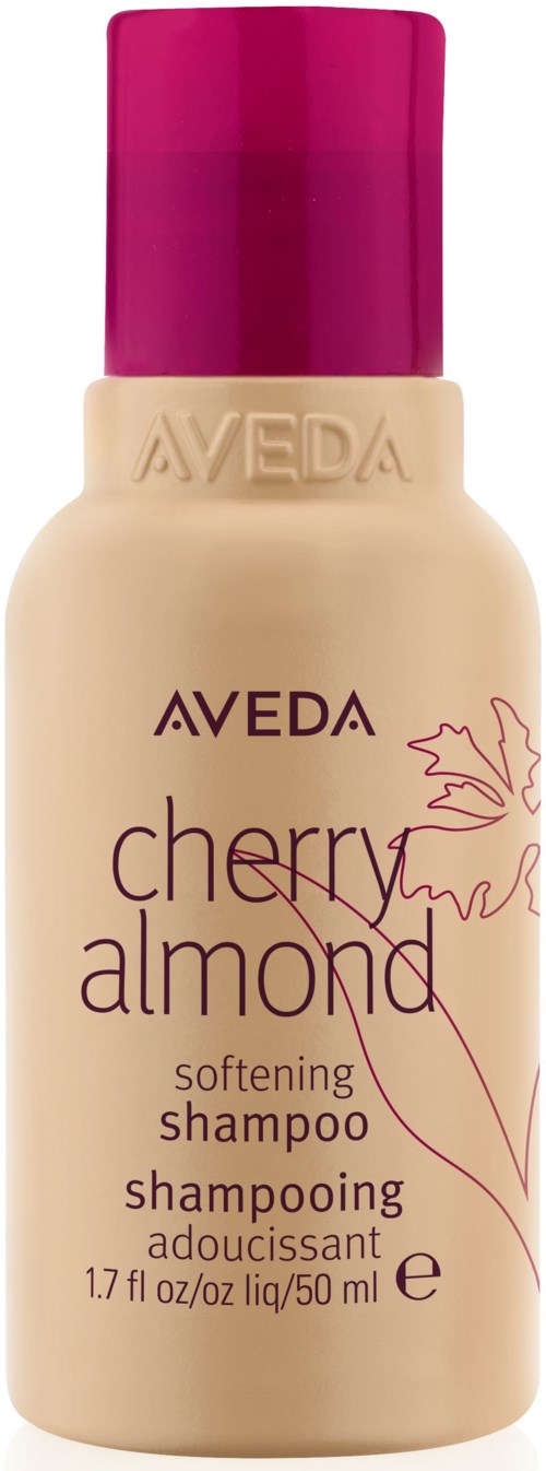 En beige flaska med rosa lock som är märkt Aveda Cherry Almond Softening Shampoo.