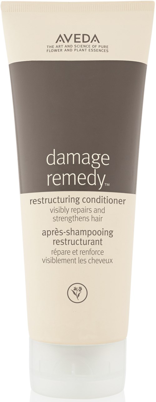 En tube med Aveda damage remedy balsam for å reparere og styrke skadet hår.