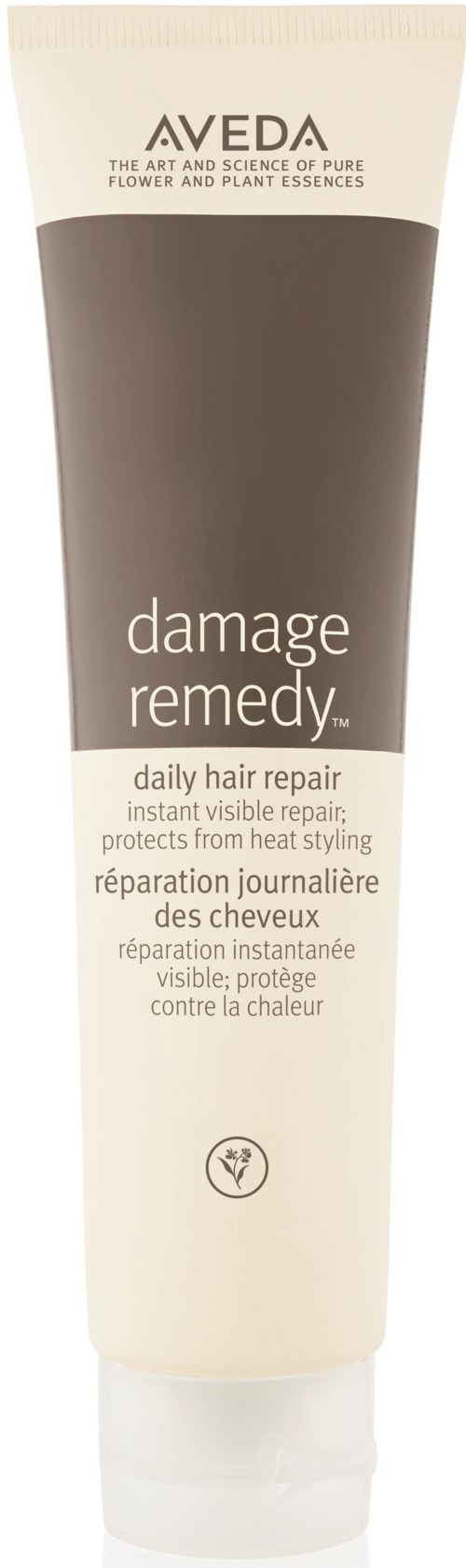 A tube of Aveda damage remedy hair repair with simple design, mainly beige and brown colors, and text describing its use.