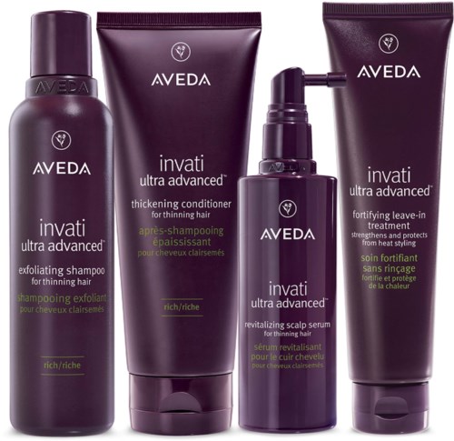 Ein Satz mit vier Aveda Invati Ultra Advanced Haarpflegeprodukten, einschließlich Shampoo, Conditioner, Kopfhautserum und Leave-in-Behandlung.