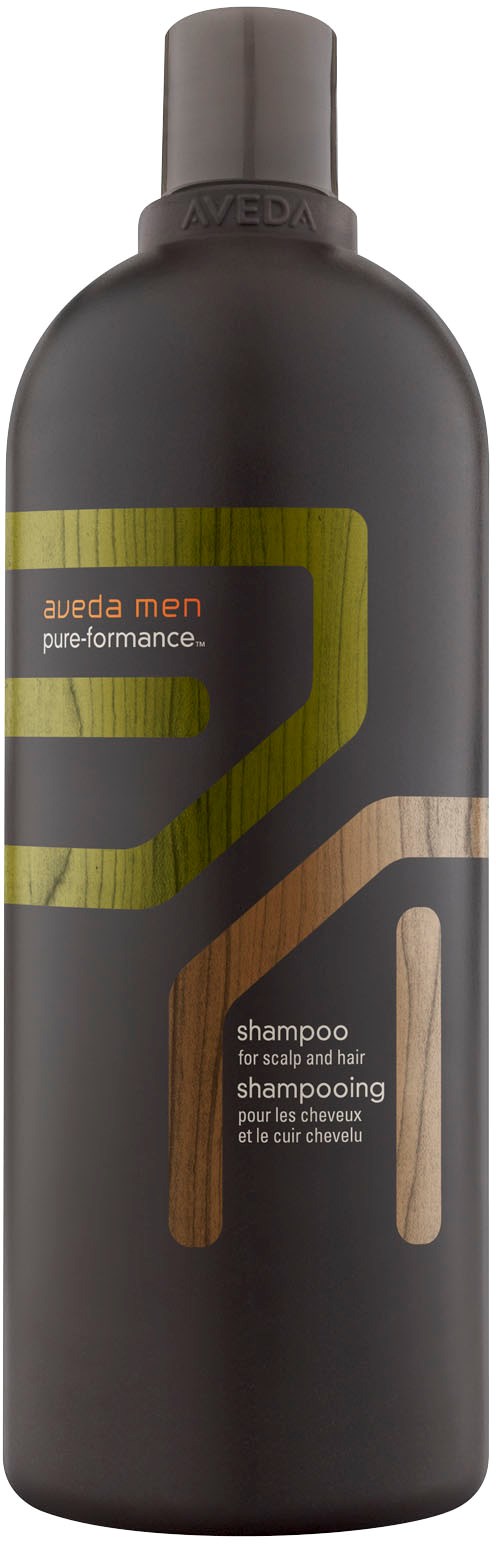 En svart flaska med Aveda Men schampo med gul och brun design, märkt för hårbotten och hårtvätt.