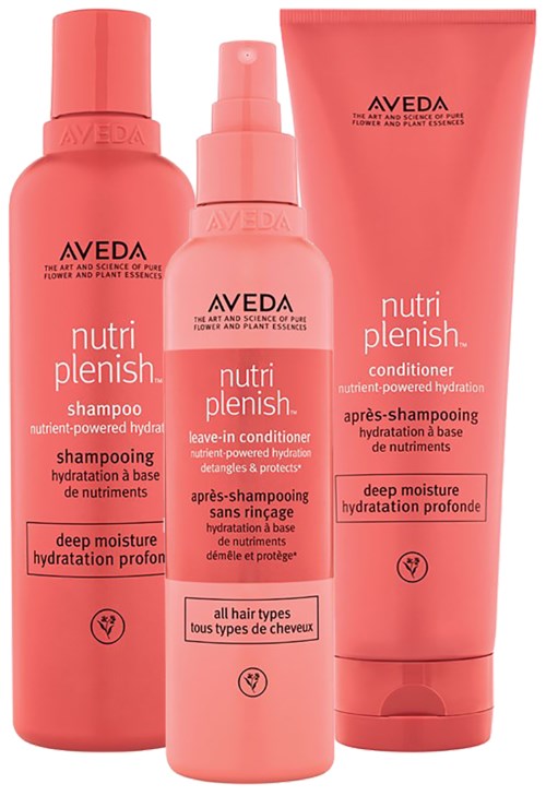 Drei pinke Flaschen mit Aveda Nutri Plenish Haarprodukten: Shampoo, Leave-in-Spülung und Tiefenpflege-Spülung.