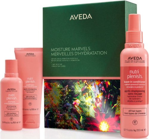 Satz mit rosa Aveda Haarpflegeflaschen und einer großen grünen Box für Feuchtigkeit und Hydratation.