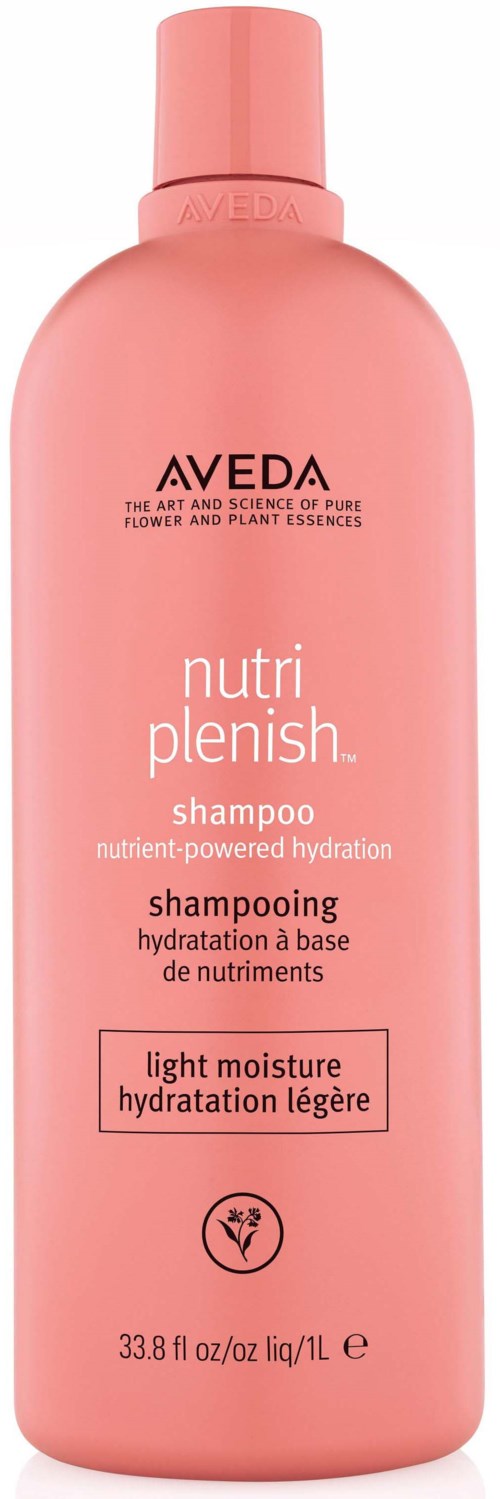 Pink shampoo bottle labeled Aveda Nutri Plenish for light moisture and hydration.