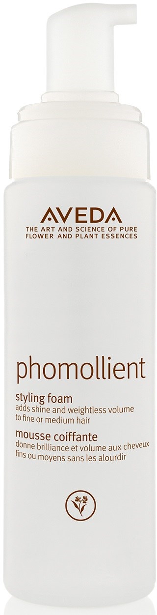 Eine weiße Flasche mit 'Aveda Phomollient' Beschriftung und Pumpe, für Haarstyling, um Glanz und Volumen zu verleihen.