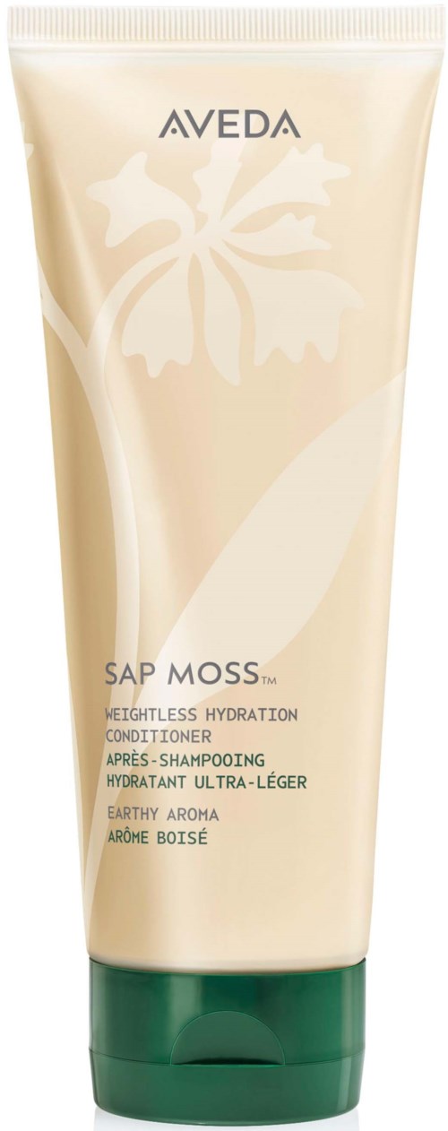 A tube labeled Aveda Sap Moss with a logo of a flower and plant, indicating hydration and earth scent.