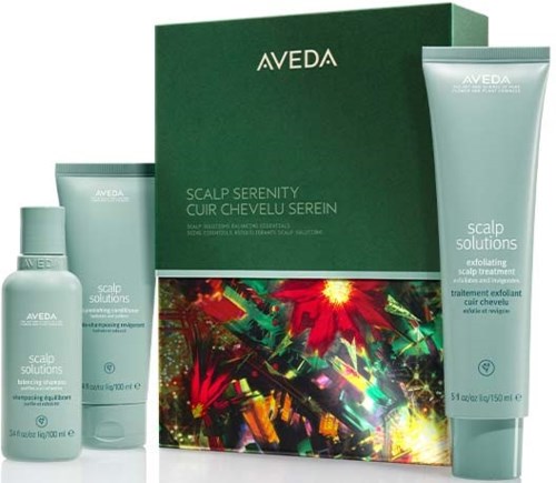Aveda scalp care set with two bottles and a green box, featuring colorful holiday-themed artwork.