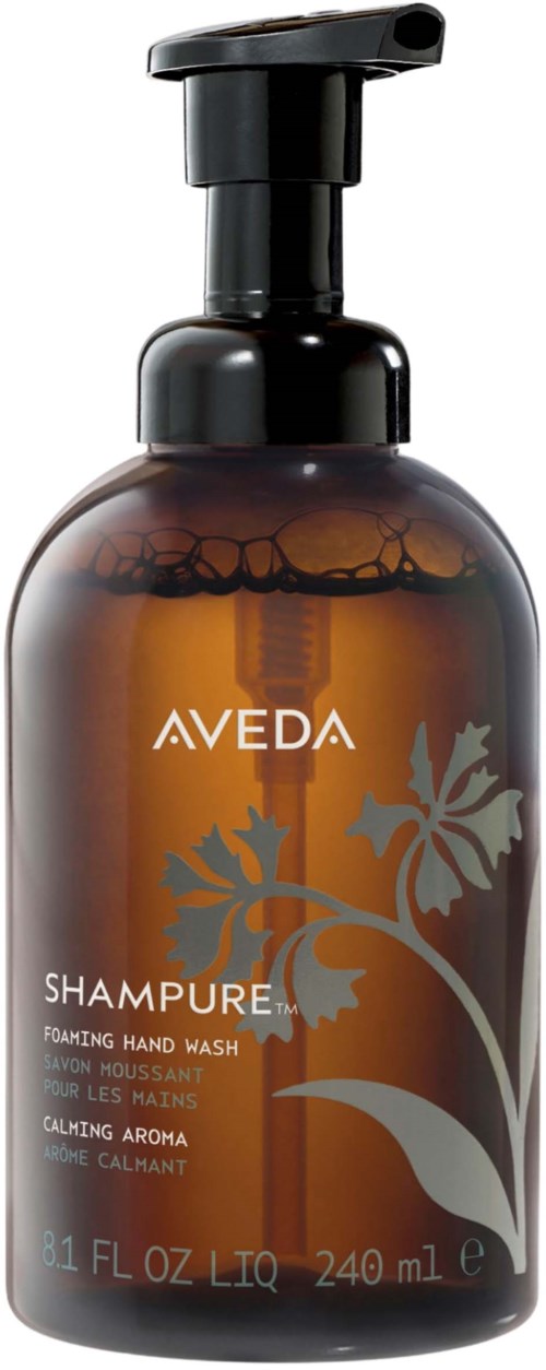 En brun flaske med Aveda-shampo med svart pumpe, merket som beroligende håndvask, inneholder 240 ml.