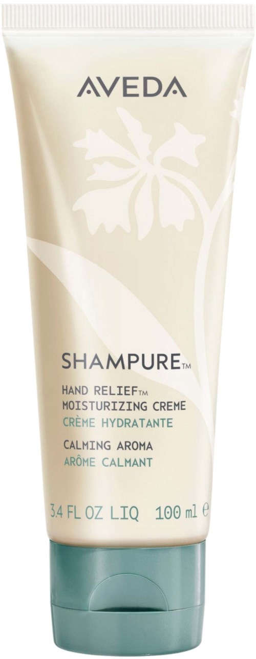 En tube med Aveda-shampoo med hvit og grønn design, med blomsterdekor og produktdetaljer.